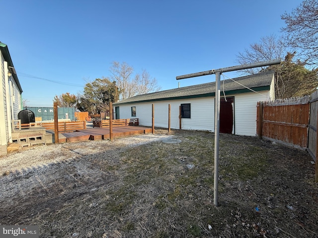 exterior space with fence and a wooden deck