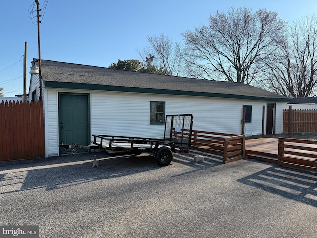 exterior space featuring a deck and fence