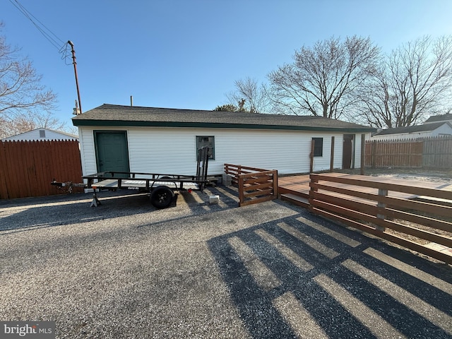 exterior space with fence and a wooden deck