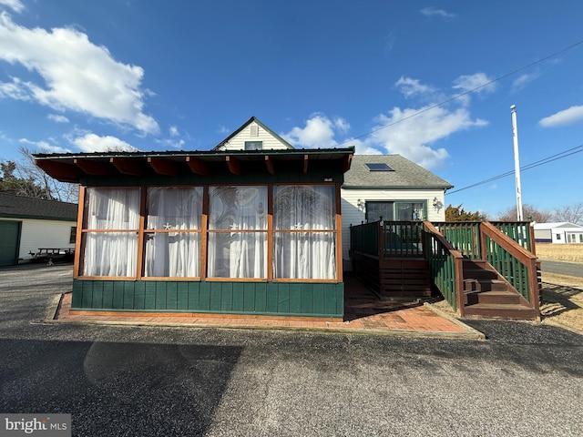 view of side of property with a deck