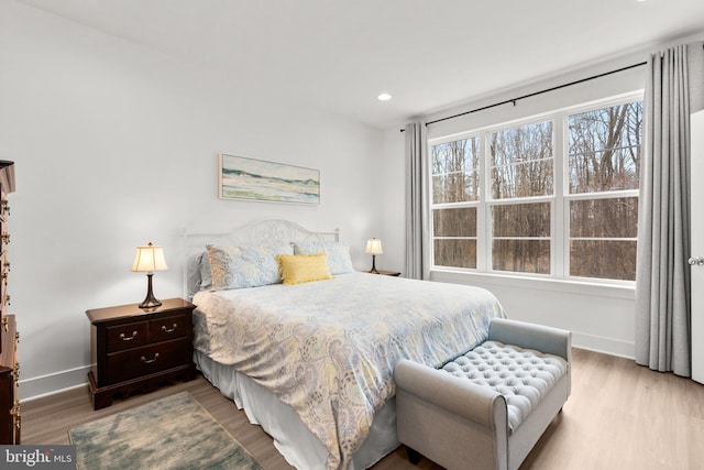 bedroom featuring recessed lighting, baseboards, and wood finished floors