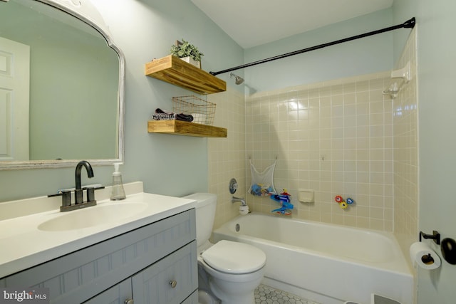 bathroom featuring shower / bath combination, vanity, and toilet