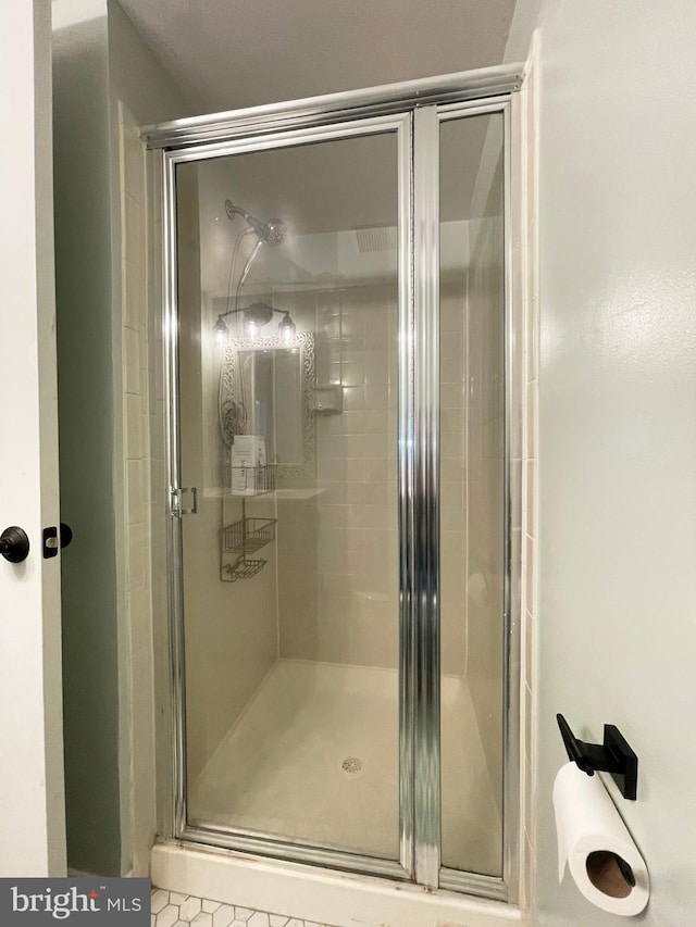 full bath with a shower stall