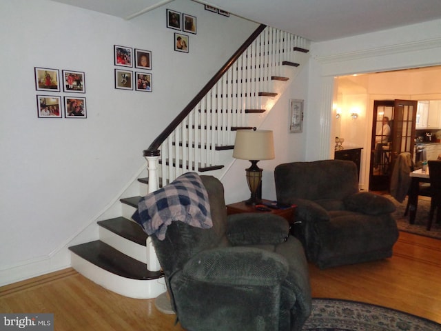 staircase featuring wood finished floors