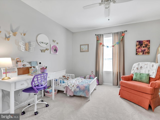 bedroom with a ceiling fan and light carpet