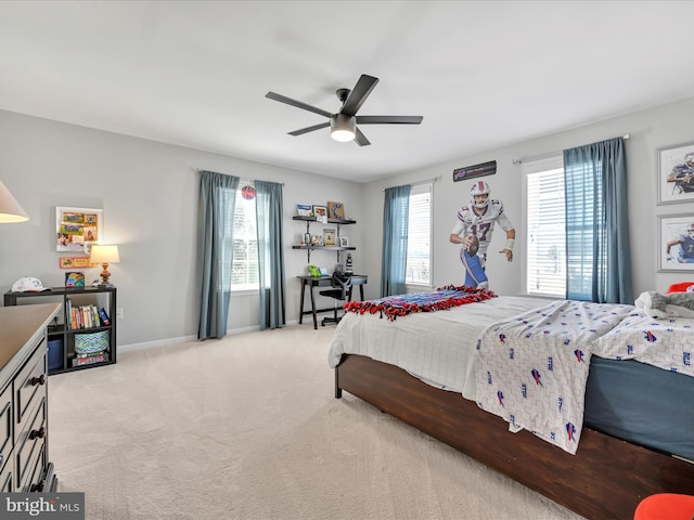 bedroom with light carpet, ceiling fan, and baseboards