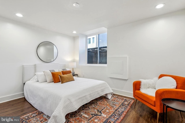 bedroom featuring recessed lighting, wood finished floors, and baseboards