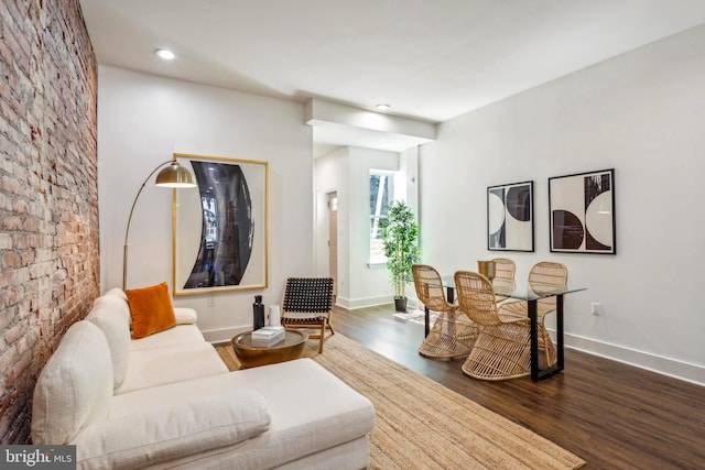 living area with dark wood finished floors, recessed lighting, and baseboards