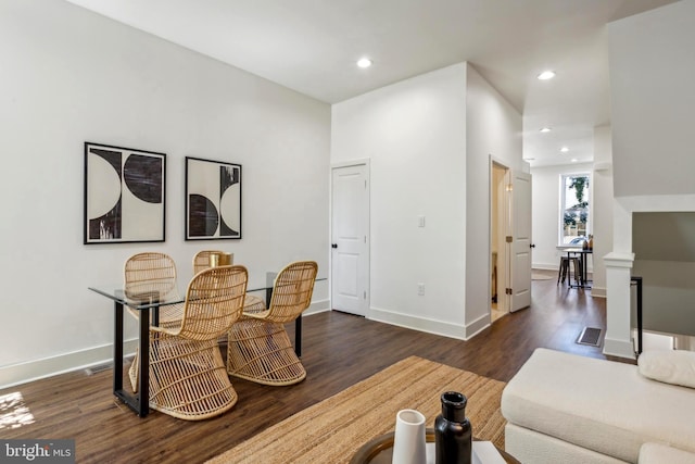 interior space featuring recessed lighting, baseboards, and wood finished floors