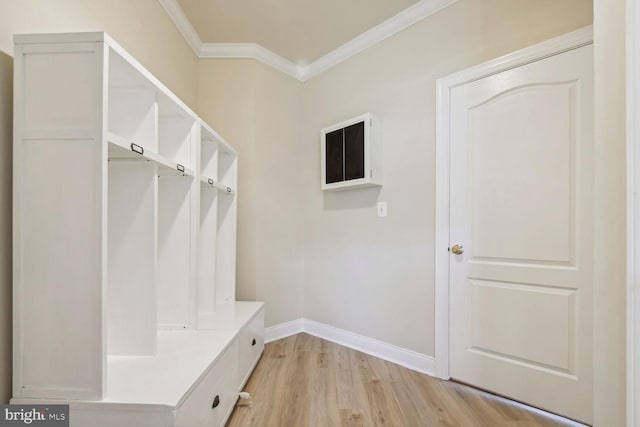 mudroom featuring light wood finished floors, ornamental molding, and baseboards