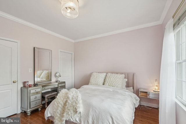 bedroom featuring dark wood-style flooring and crown molding