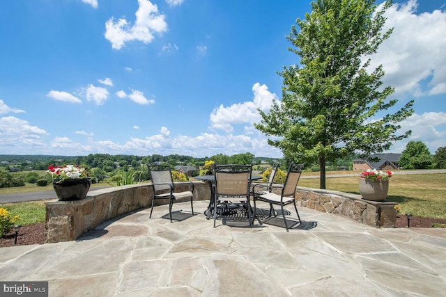 view of patio featuring outdoor dining space