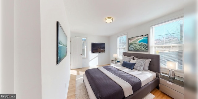 bedroom with light wood-style floors