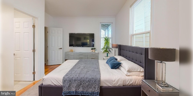 bedroom with light wood finished floors