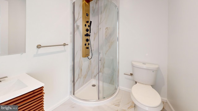 full bath featuring marble finish floor, toilet, vanity, and a marble finish shower