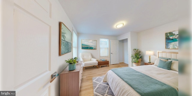 bedroom featuring light wood-style floors