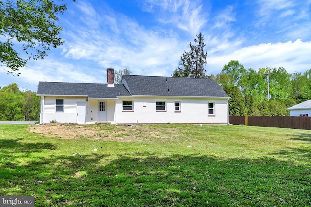 3523 Level Rd, Churchville, MD 21028 - rear view of house featuring fence, a chimney, a yard, and stucco siding