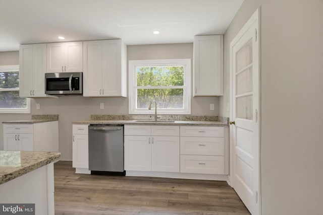 3523 Level Rd, Churchville, MD 21028 - kitchen with appliances with stainless steel finishes, wood finished floors, a sink, light stone counters, and white cabinets