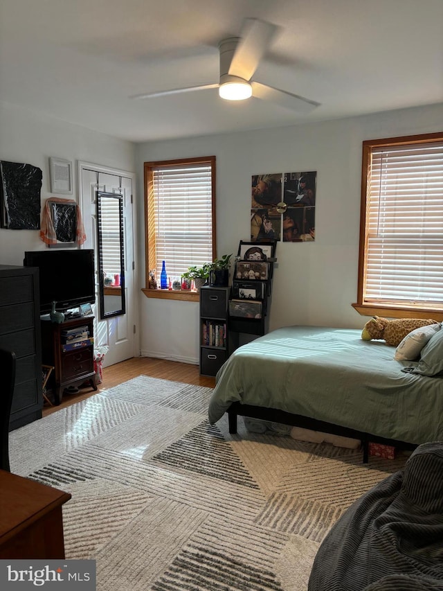 bedroom with wood finished floors and a ceiling fan