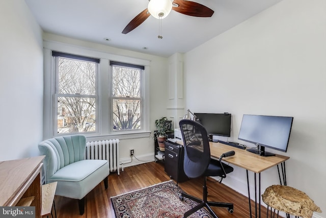 office with radiator, ceiling fan, baseboards, and wood finished floors