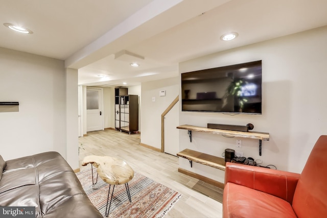 living room with wood finished floors and recessed lighting