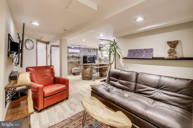 living area featuring wood finished floors and recessed lighting