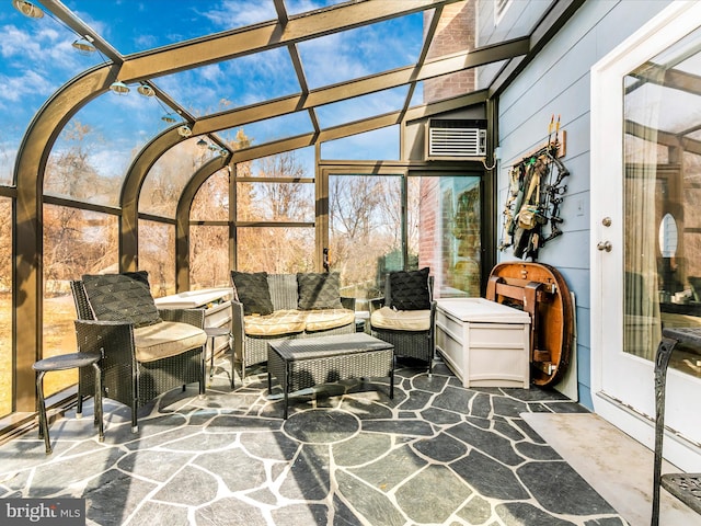 view of patio with glass enclosure and an outdoor hangout area