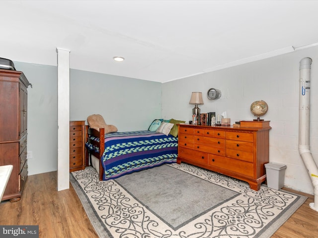 bedroom featuring wood finished floors