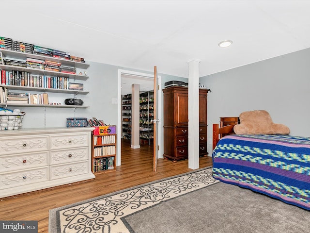 bedroom featuring wood finished floors