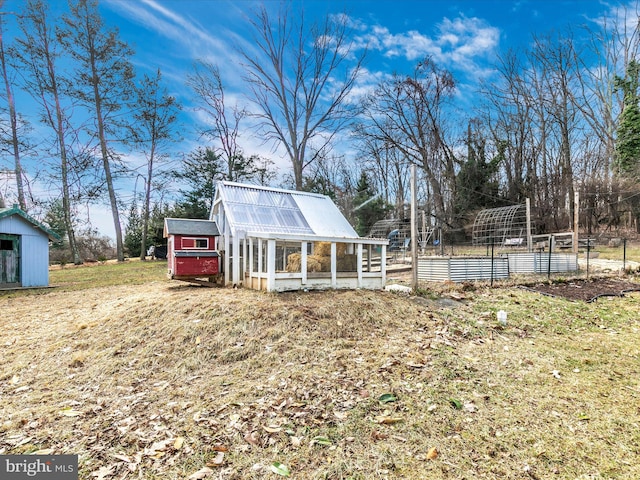 view of greenhouse featuring a vegetable garden