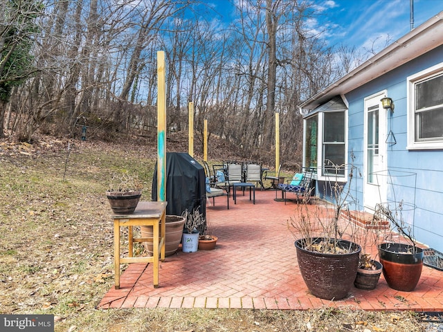 view of patio featuring a grill