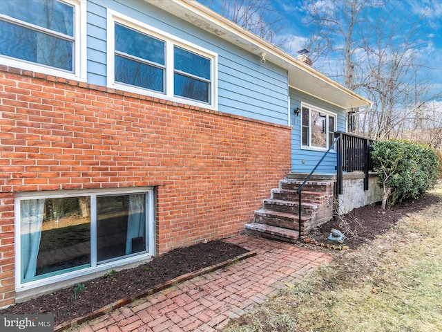 exterior space featuring brick siding