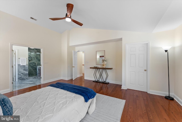 bedroom featuring lofted ceiling, visible vents, baseboards, and wood finished floors