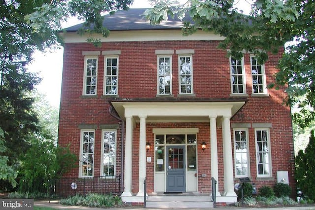 view of front of home with brick siding