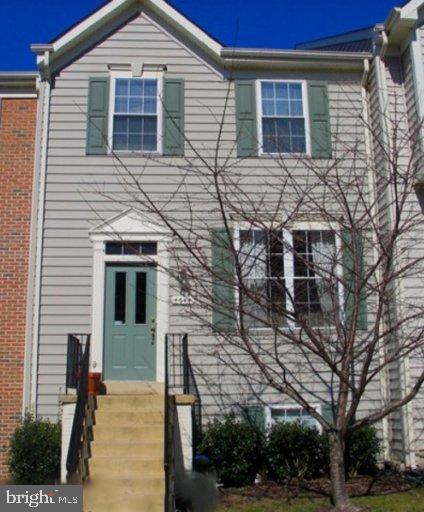 townhome / multi-family property with brick siding