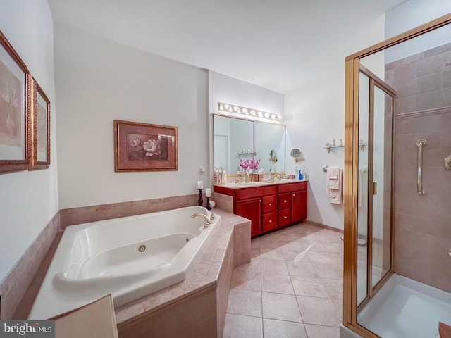 full bath featuring double vanity, a tub with jets, tile patterned floors, a shower stall, and a sink