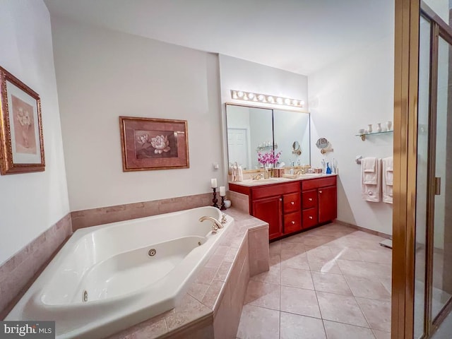 bathroom featuring tile patterned flooring, a sink, a whirlpool tub, and double vanity