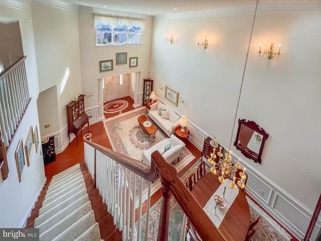 staircase featuring crown molding