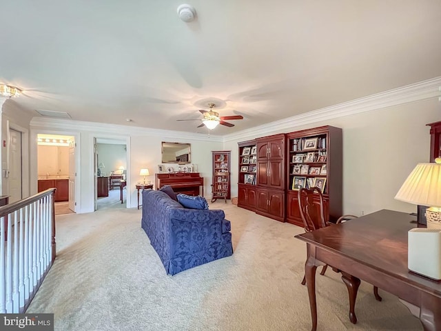 living area featuring a ceiling fan, light colored carpet, and crown molding