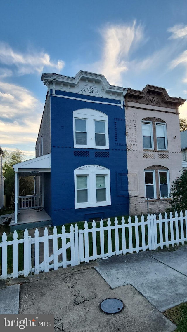 view of property exterior featuring a fenced front yard