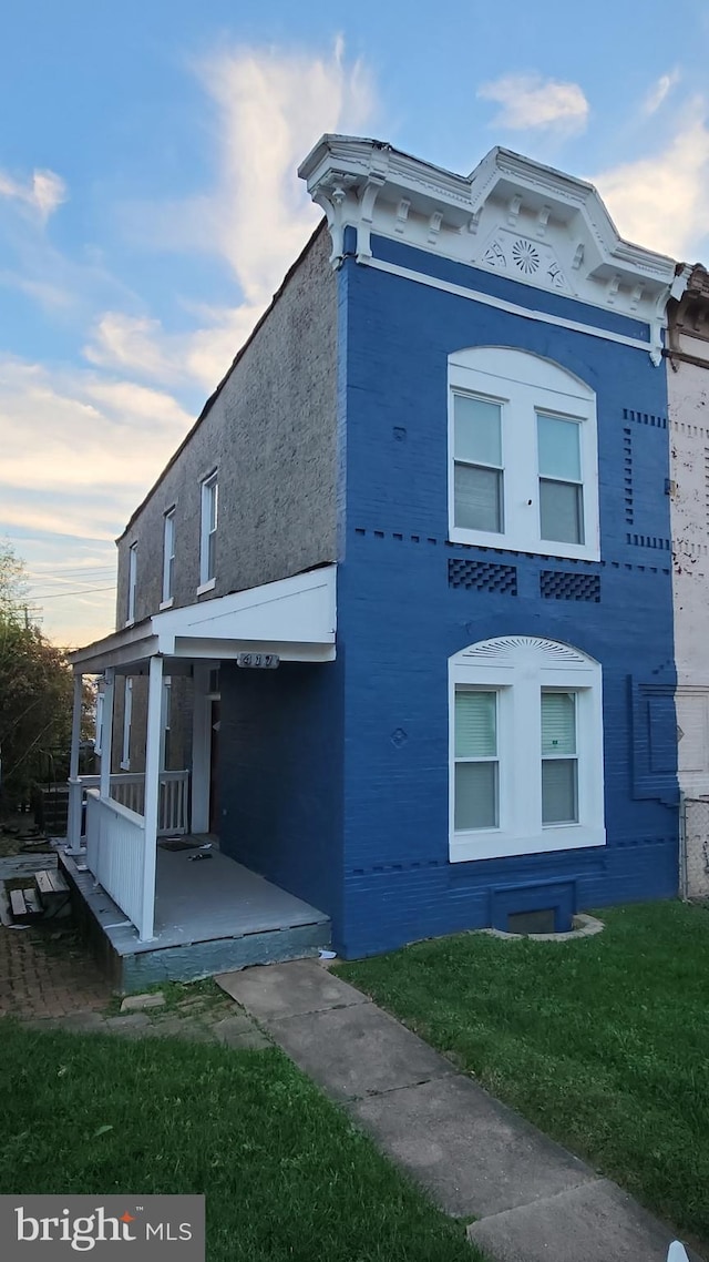 view of property exterior with a yard