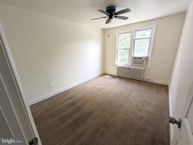 carpeted spare room featuring cooling unit, baseboards, ceiling fan, and radiator heating unit