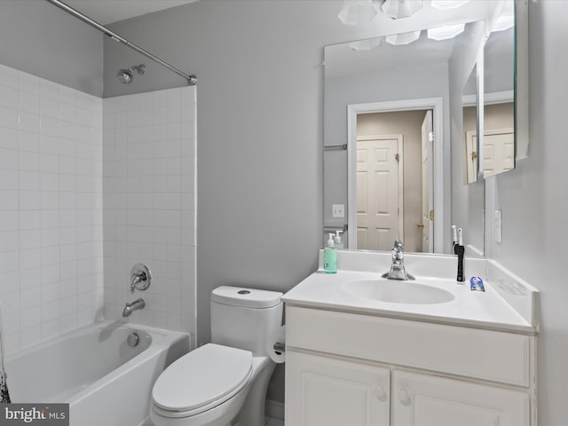 bathroom featuring shower / bath combination, vanity, and toilet