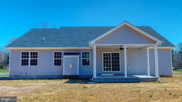 back of house featuring a yard, crawl space, roof with shingles, and ceiling fan