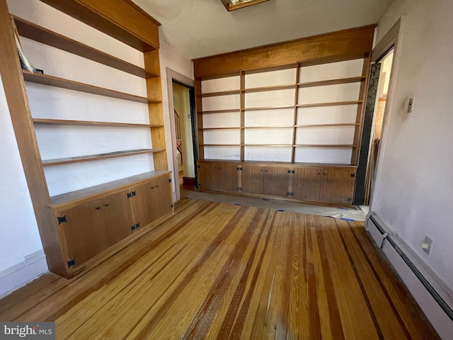 interior space featuring light wood-type flooring and a baseboard radiator