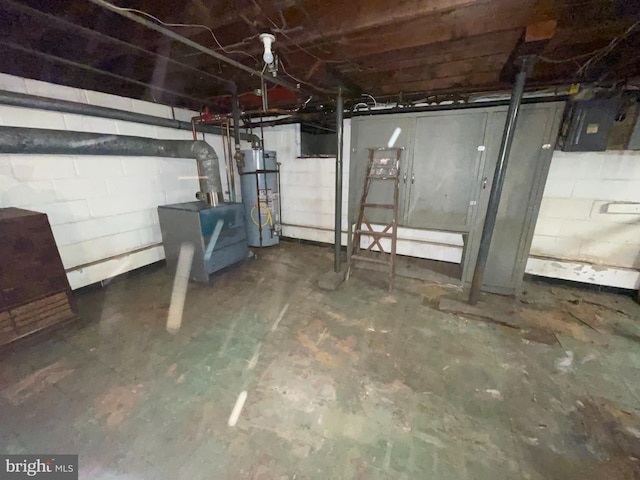 unfinished basement featuring secured water heater and electric panel