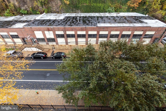 view of building exterior featuring uncovered parking