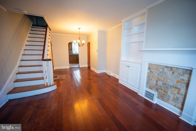 foyer with baseboards, visible vents, ornamental molding, dark wood-style flooring, and stairs