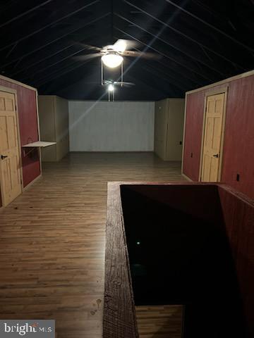 interior space featuring a ceiling fan and wood finished floors