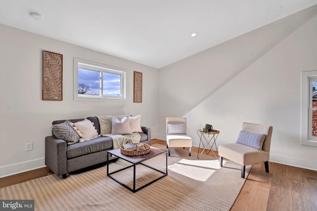 living room featuring light wood finished floors and baseboards